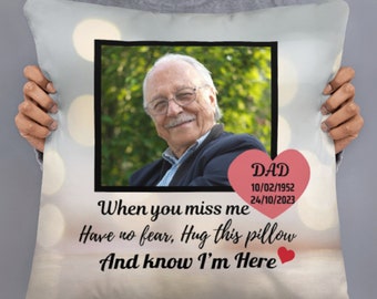 May include: A white pillow with a photo of a man in a black jacket. The pillow has the text "DAD 10/02/1952 24/10/2023 When you miss me Have no fear, Hug this pillow And know I'm Here" printed on it.