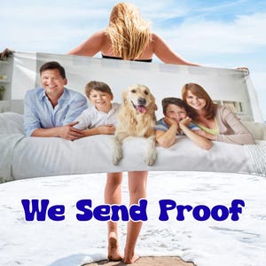 May include: A rectangular beach towel featuring a printed photograph of a family consisting of a man, a woman, two children, and a golden retriever dog. The text "We Send Proof" is printed in bold blue letters at the bottom of the towel.