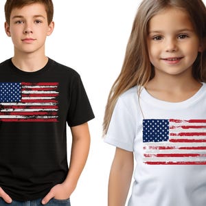 May include: Two children wearing t-shirts with a distressed American flag design. One shirt is black, the other is white. The flag features a blue square with white stars and red and white stripes.