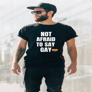 Not Afraid To Say Gay tshirt, Florida Bill against LGTBQ rights tshirt, Say Gay tshirt, Pride tshirt, I&#39;m with the Banned, Say Gay tshirt