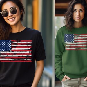 May include: Two people wearing apparel featuring a distressed American flag design. One person wears a black t-shirt, and the other wears a green sweatshirt. The flag design includes blue, white, and red colors.