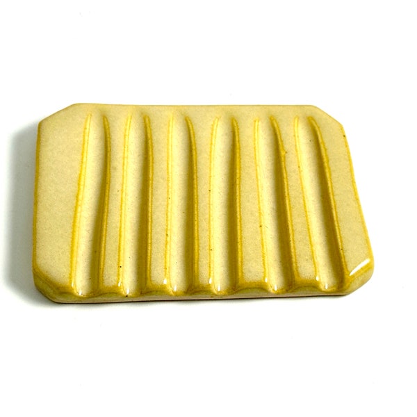 Yellow soap dish