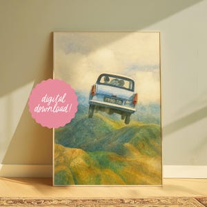 May include: Watercolor print of a light blue car with the license plate "7990 TD" flying over green hills. The artwork is framed and includes a pink sticker that says "digital download!"