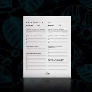 May include: A printable daily check-in sheet with sections for morning and bedtime. The sheet includes prompts for gratitude, intentions, mini-milestones, and things that made you smile. The text "DAILY CHECK-IN" is at the top of the sheet.