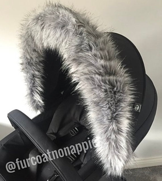 grey pram with fur hood