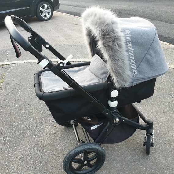 grey pram with fur