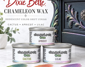 May include: Three round metal tins of Dixie Belle Chameleon Wax in Apricot, Cactus, and Lilac. Each tin features a white label with black text and a holographic rim. Swatches of iridescent color-shift wax are displayed in front of the tins.