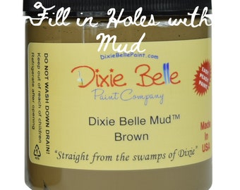 May include: A brown jar of Dixie Belle Mud™ paint, labeled "Fill in Holes with Mud". The jar is labeled "Dixie Belle Mud™ Brown" and "Straight from the swamps of Dixie".