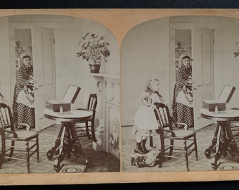 Stereoview of Little Girl Asking Doctor How He Brought a Baby in his Bag from 1874