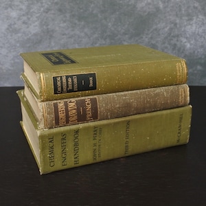 May include: Three vintage engineering textbooks stacked on top of each other. The books are in shades of green and brown, with gold lettering on the spines. Titles include "Chemical Engineers' Handbook" and "Chemical Engineering Thermodynamics".