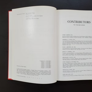 May include: A page from a book titled "Contributors to Volume Seven" with a list of contributors and their titles. The contributors are listed in alphabetical order.