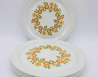 Set of 4 pretty flower power 7 inch side tea plates by Myott. Garland design. Made in England.