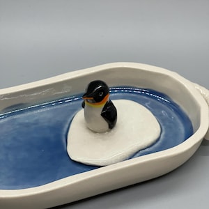 May include: A handmade wooden sign with the text "Welcome" in a handwritten style. The sign is painted white with a distressed finish and features a small, decorative heart. It is designed for indoor or outdoor use.