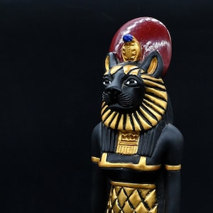 statue of Sekhmet warrior goddess painted gold black Ancient Egypt altar statue made in Egypt