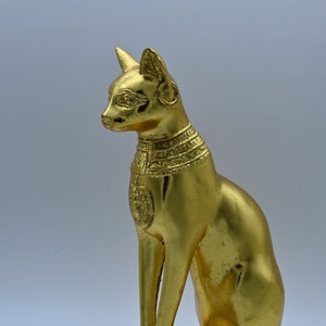 statue of Ancient Egyptian art goddess cat Bastet heavy stone gold leaf made in egypt