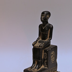 Unique statue of Egyptian art Seated statue of Imhotep holding an open papyrus scroll stone made in egypt