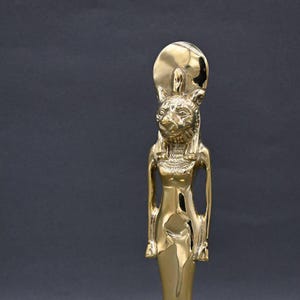 statue of the warrior goddess Sekhmet Goddess of war made of copper ancient Egypt altar made in Egypt