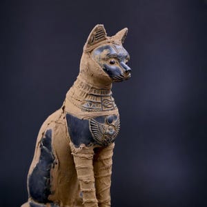 unique goddess Bastet cat large statue black , scarab on chest, symbols hieroglyphic inscriptions around the base made in Egypt