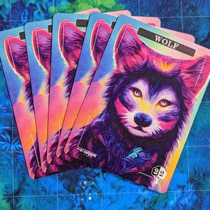 May include: Five colorful playing cards with a wolf illustration on the front. The card reads "WOLF" and has the number "22" in the bottom right corner.