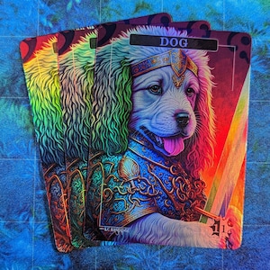 May include: A holographic playing card with a white dog wearing a gold crown and blue armor holding a sword. The card has the word "DOG" printed on it.
