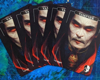 May include: Five black playing cards with a vampire illustration on each card. The cards have red borders and the word "Vampire" is printed in white on the top of the card.