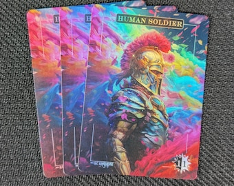 May include: A fantasy-style trading card with a colorful background and a warrior in armor. The card is titled "HUMAN SOLDIER" and has a number "1" in the bottom right corner.