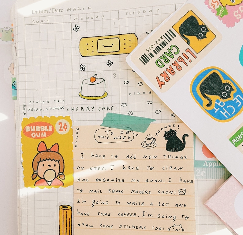 May include: A to-do list with handwritten notes on a yellow sticky note. The notes say "To Do This Week" and "I have to add new things on Etsy. I have to clean and organize my room. I have to mail some orders soon! I'm going to write a lot and have some coffee. I'm going to draw some stickers too!"