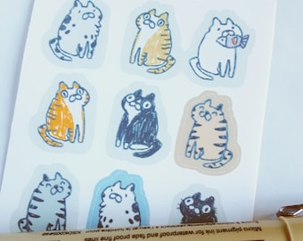 May include: A sheet of stickers featuring nine adorable hand-drawn illustrations of cats in various poses. The cats are depicted in a cartoon style with simple lines and colors. The stickers are perfect for adding a touch of whimsy to journals, laptops, or other surfaces.