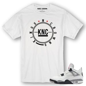 Kings N Crowns Tee shirt to match Jordan 4 White Cement Sneakers.