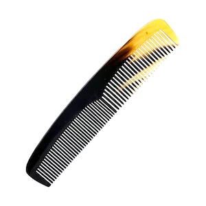 May include: A black and brown tortoiseshell comb with fine teeth.