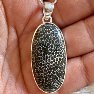 Stingray Coral natural gemstone pendant set in 925 sterling silver with choice of length sterling snake chain.