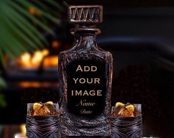May include: A dark brown, textured glass decanter with a matching stopper and two matching glasses, each containing amber liquid and ice. The decanter features a central black panel with the text ADD YOUR IMAGE Name Date in gold lettering.