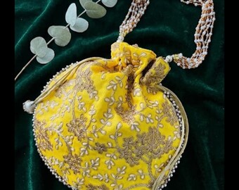 Our handmade Antique Zari Work silk mix  Potli for women