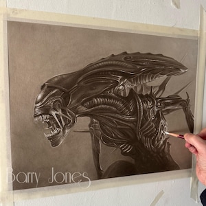 May include: A detailed pencil drawing of an alien creature from the movie Alien. The creature is depicted in a menacing pose with its mouth open and teeth bared. The drawing is done in shades of gray and black on a brown background.