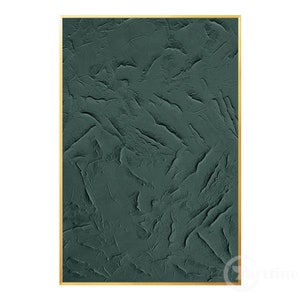 May include: Abstract art print with a textured, dark green background. The print is framed with a thin gold frame.