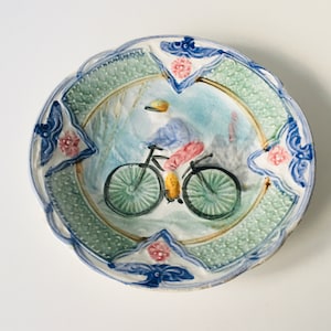 Antique 19th century Majolica plate Chinese man on bicycle