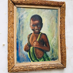 May include: A framed oil painting of a young boy wearing a green and brown outfit. The boy is smiling and looking directly at the viewer. The painting is set against a blue and white background.