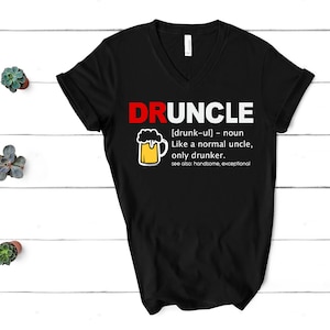 May include: Black V-neck t-shirt with the text "DRUNCLE" in red and white, accompanied by a definition and a beer mug graphic. The definition reads "Like a normal uncle, only drunker."