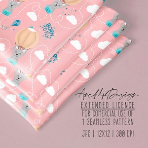 Puede incluir: Un patrón sin costuras rosa con un lindo conejito gris en un globo aerostático con el texto "Born to Fly". El patrón también incluye nubes blancas y confeti azul y rosa.