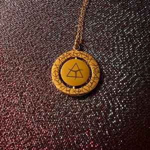 Colgante giratorio de acero inoxidable Bell and Mark de Lirael y Kibeth