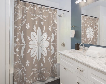 May include: A shower curtain with a beige background and a white floral pattern. The pattern features stylized flowers, leaves, and branches.