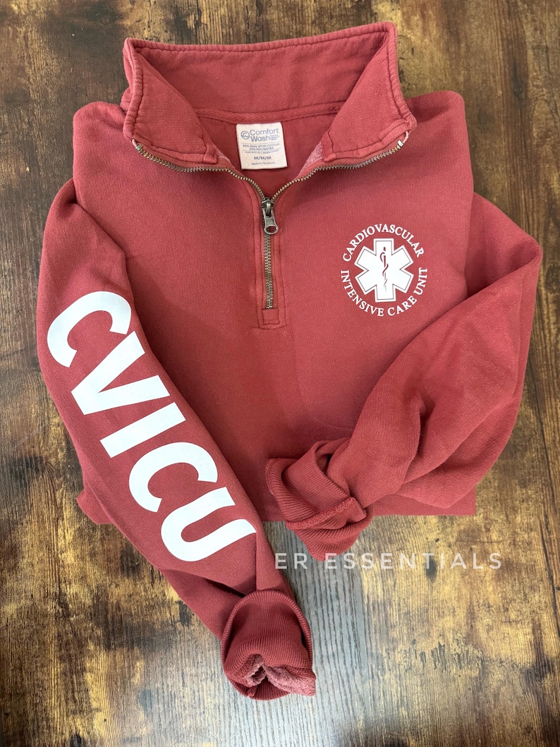 May include: A maroon quarter-zip sweatshirt with the text "CVICU" in white on the left sleeve and a white logo with the text "Cardiovascular Intensive Care Unit" on the front.