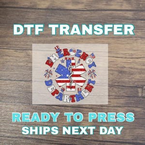 May include: DTF transfer featuring an emergency medical services design. The design includes a star of life symbol with red, white, and blue colors, surrounded by text that reads "Emergency Department". The text "Ready to Press" and "Ships Next Day" are also included.