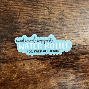 May include: A light blue sticker with the text "emotional support water bottle (SO, BACK OFF JCAHO)"