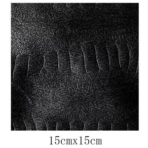 May include: A black and white textured fabric with a subtle pattern. The fabric is 15 inches by 15 inches.