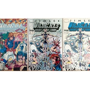 May include: Three WildC.A.T.S Covert Action Teams comic books by Jim Lee. The first issue features a colourful group of characters in action. The second and third issues display identical cover art with a central figure and blue text.