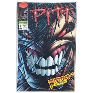 May include: A comic book titled "PITT" with a close-up of a monstrous face with red eyes and sharp teeth. The cover features the word "PITT" in red, dripping letters. The comic is in a protective sleeve.