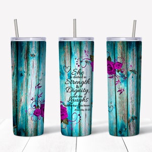 May include: A turquoise and purple tumbler with a wood grain pattern and a floral design. The tumbler has a quote that reads "She is clothed in Strength & Dignity, and she Laughs without fear of the future - Proverbs 31:25".