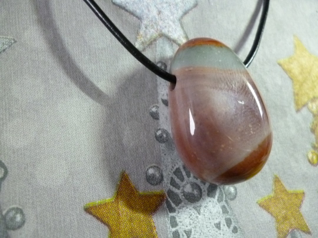 A Polychrome Jasper Pendant in the Shape of a Teardrop and Drilled ...