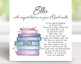 May include: A white card with a watercolor illustration of a stack of books with butterflies. The card says "Ellie with congratulations on your A-level results 2023" and includes a message congratulating the recipient on their achievements.